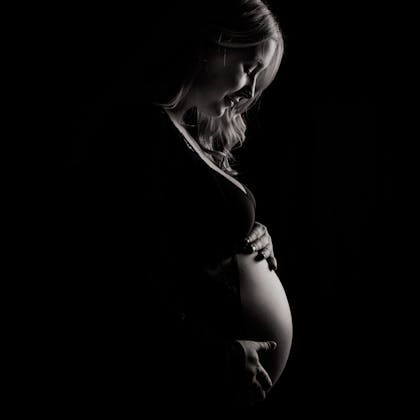 Striking monochrome image capturing the beauty and elegance of pregnancy.